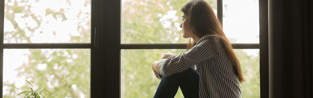 woman looking out of a window